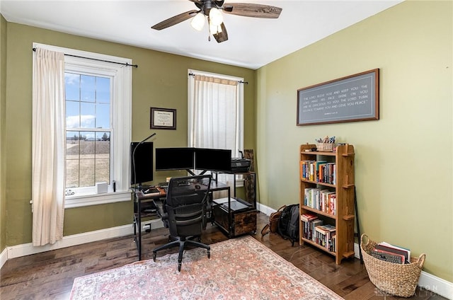 office space with baseboards and wood finished floors