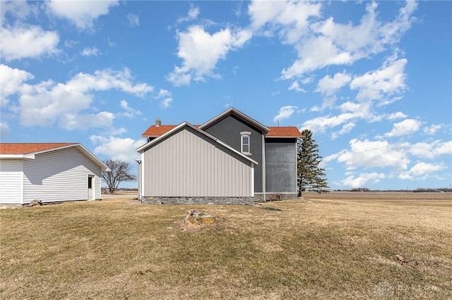 view of property exterior with a yard