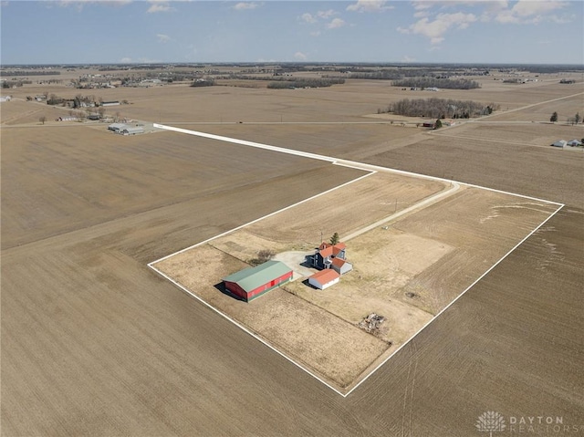 birds eye view of property with a rural view