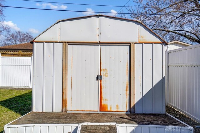 view of shed with a fenced backyard