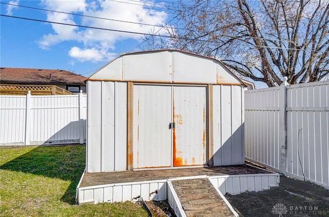 view of shed featuring a fenced backyard