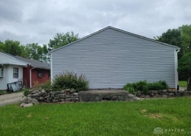 view of home's exterior with a yard