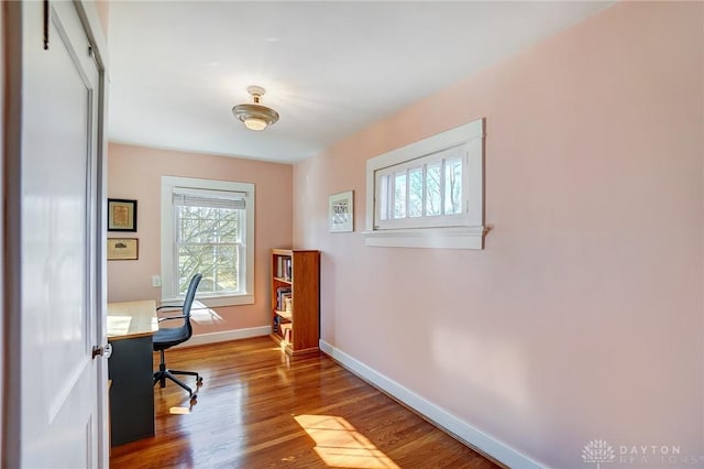 office area featuring wood finished floors and baseboards