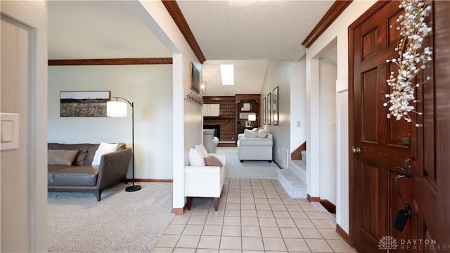 interior space with stairway, ornamental molding, a fireplace, and light carpet