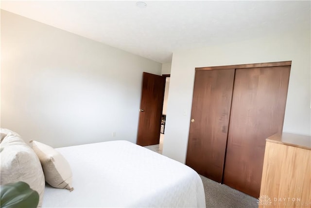 carpeted bedroom with a closet