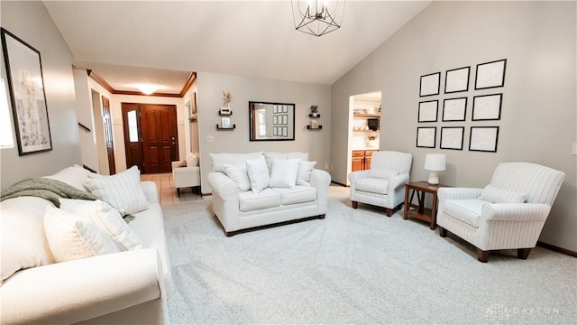 living area featuring baseboards, carpet flooring, and vaulted ceiling