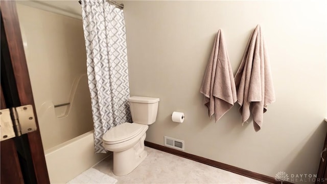 bathroom featuring visible vents, baseboards, toilet, and shower / bath combination with curtain