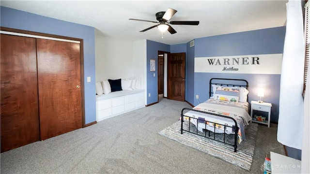 bedroom featuring visible vents, baseboards, carpet floors, and ceiling fan