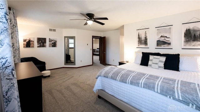 bedroom featuring visible vents, baseboards, ceiling fan, and carpet flooring