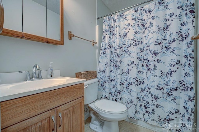 bathroom with vanity, tile patterned floors, toilet, and a shower with curtain