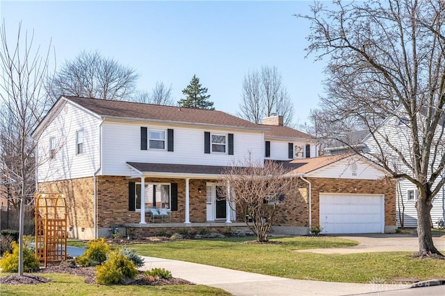 traditional-style house with brick siding, a front lawn, concrete driveway, a chimney, and an attached garage