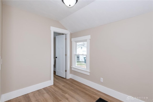 2724 Whittier Ave, Dayton, OH 45420 - unfurnished room with light wood-style flooring, visible vents, baseboards, and vaulted ceiling