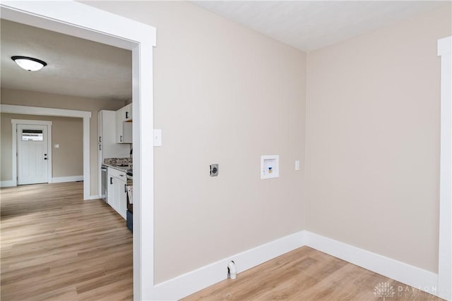 2724 Whittier Ave, Dayton, OH 45420 - laundry area featuring baseboards, light wood finished floors, hookup for a washing machine, and electric dryer hookup