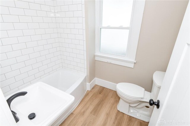 2724 Whittier Ave, Dayton, OH 45420 - full bathroom featuring toilet, wood finished floors, and baseboards
