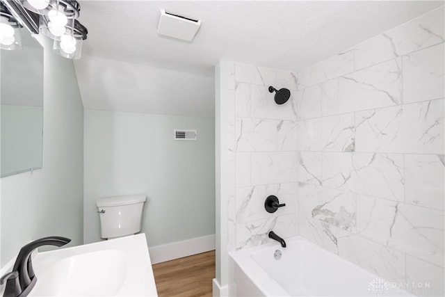 2724 Whittier Ave, Dayton, OH 45420 - full bath featuring visible vents, wood finished floors, a sink, shower / bathing tub combination, and baseboards