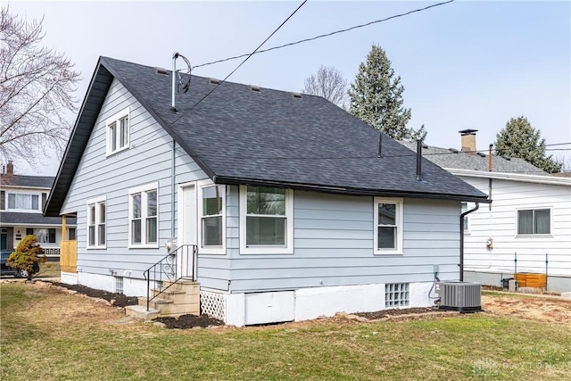 2724 Whittier Ave, Dayton, OH 45420 - back of property featuring a yard, entry steps, cooling unit, and roof with shingles