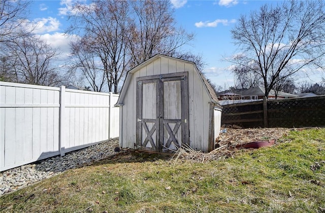 view of shed with a fenced backyard