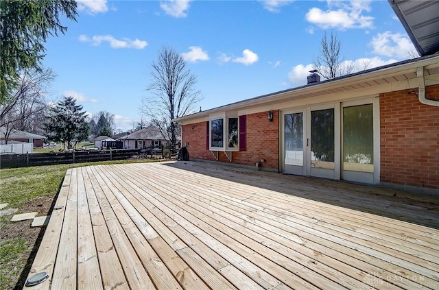 wooden terrace featuring french doors and fence