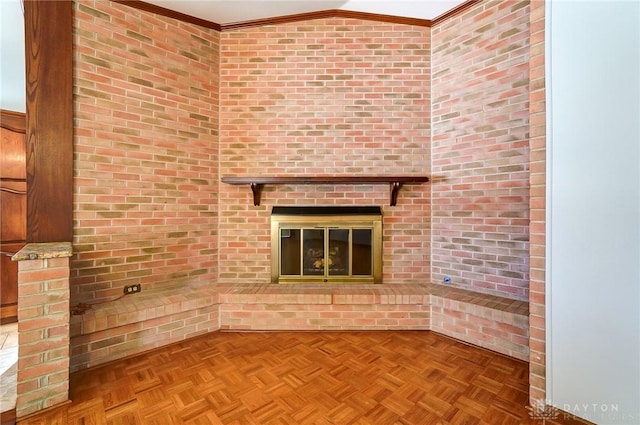 unfurnished living room featuring lofted ceiling, a brick fireplace, and ornamental molding