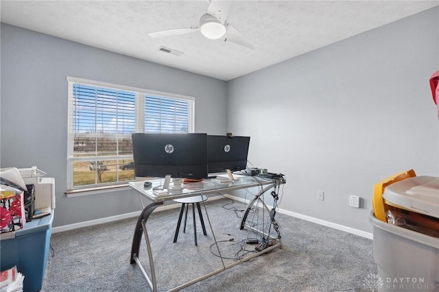 office area with visible vents, baseboards, and carpet