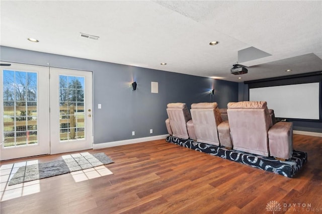 cinema featuring visible vents, recessed lighting, baseboards, and wood finished floors