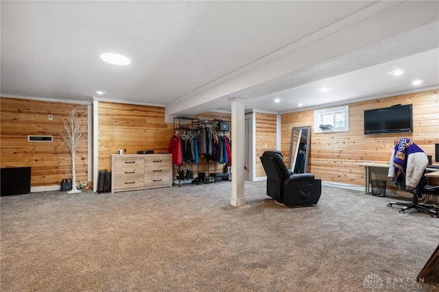 interior space featuring recessed lighting, carpet, and wood walls