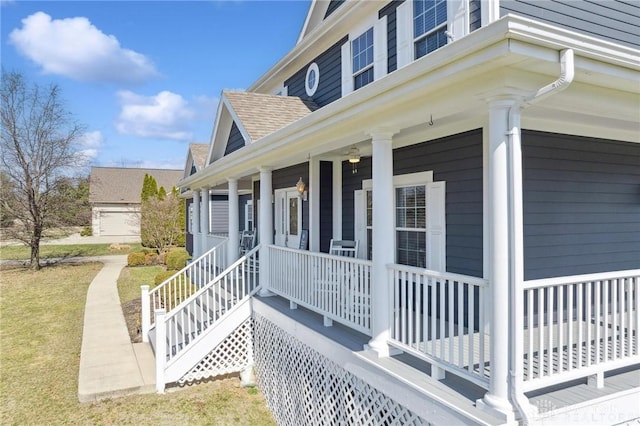 view of property exterior featuring a porch and roof with shingles