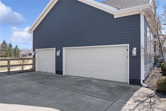 garage featuring fence