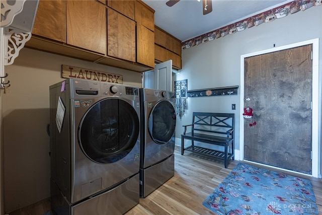 laundry room featuring washer and clothes dryer, cabinet space, light wood-style floors, baseboards, and ceiling fan