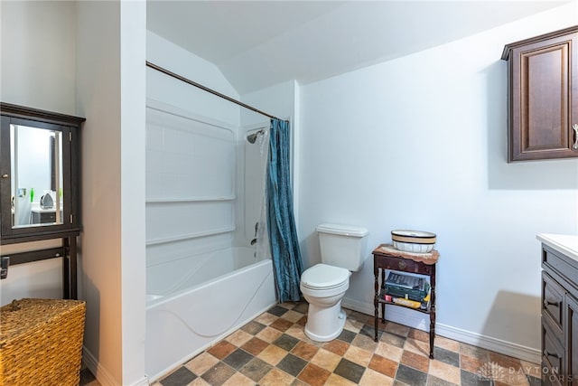 bathroom with baseboards, toilet, shower / tub combo with curtain, vaulted ceiling, and vanity