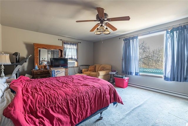 carpeted bedroom featuring baseboard heating and ceiling fan