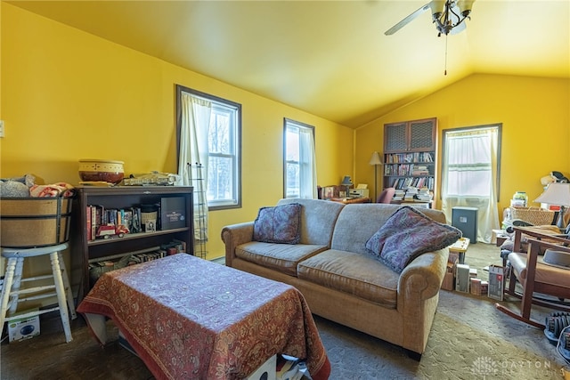 living area with lofted ceiling, carpet floors, and ceiling fan