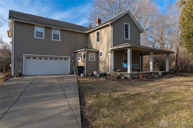 traditional-style home with a porch, concrete driveway, a front yard, a chimney, and a garage