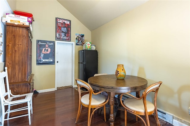 dining room with baseboards, dark wood-type flooring, lofted ceiling, and a baseboard radiator