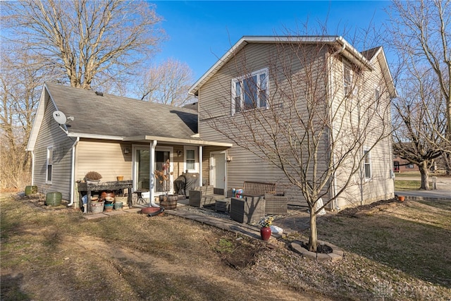 back of property featuring an outdoor hangout area