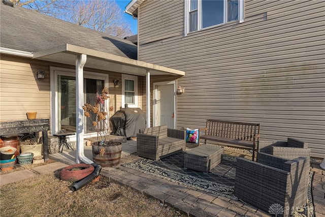 view of patio with an outdoor living space and grilling area