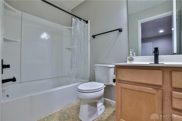 bathroom with vanity, baseboards, tile patterned flooring, shower / tub combo, and toilet