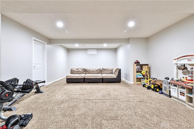 carpeted living room featuring recessed lighting and baseboards