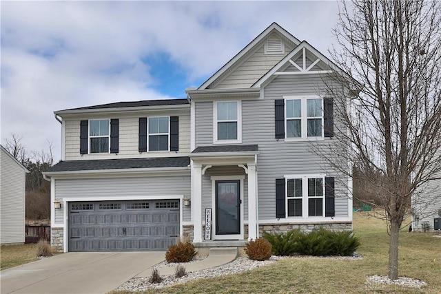 craftsman inspired home with concrete driveway, a garage, stone siding, and a front yard