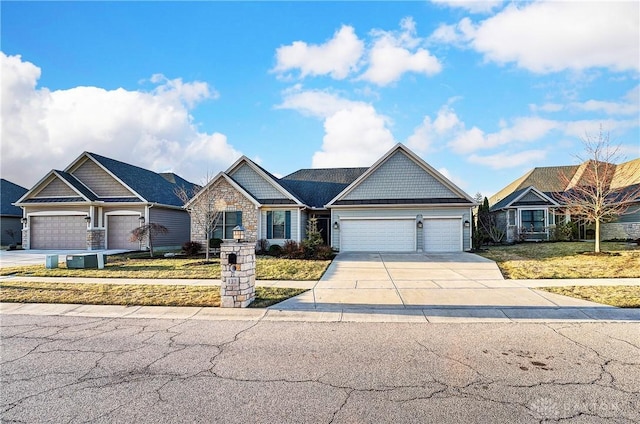 craftsman-style house with stone siding, driveway, an attached garage, and a front lawn