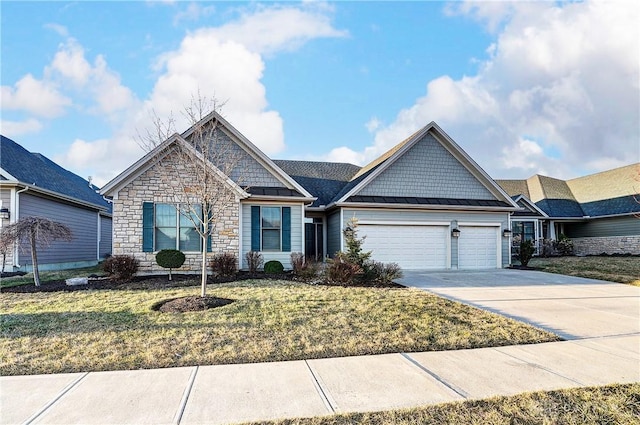 craftsman-style house with concrete driveway, a front yard, metal roof, an attached garage, and a standing seam roof