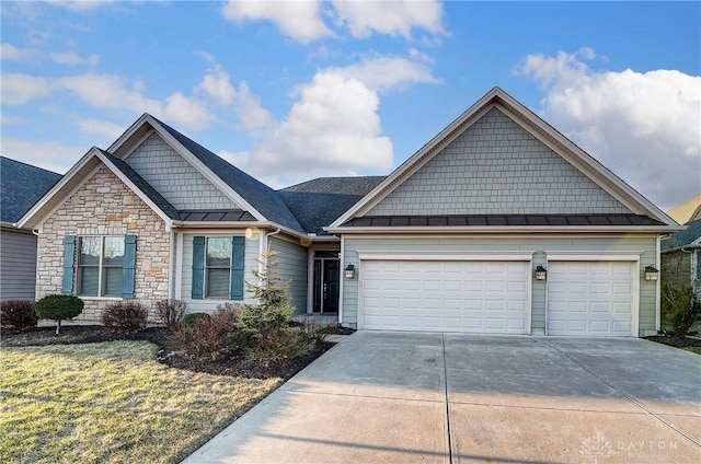 view of front facade featuring driveway, a standing seam roof, an attached garage, stone siding, and metal roof