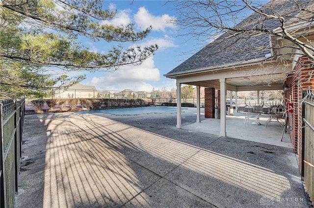 exterior space with a patio and fence