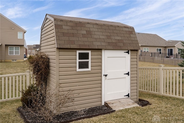 view of shed with a fenced backyard