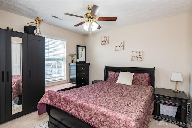 bedroom featuring visible vents and ceiling fan