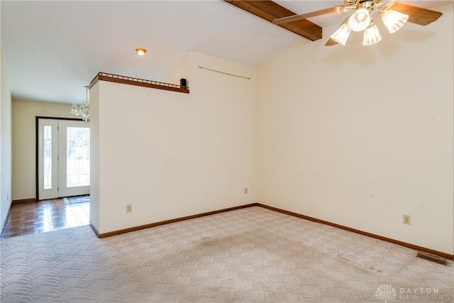 unfurnished room featuring visible vents, baseboards, carpet, lofted ceiling with beams, and a ceiling fan