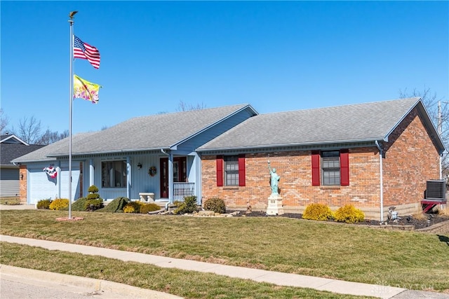 ranch-style home featuring brick siding, a front yard, roof with shingles, covered porch, and an attached garage