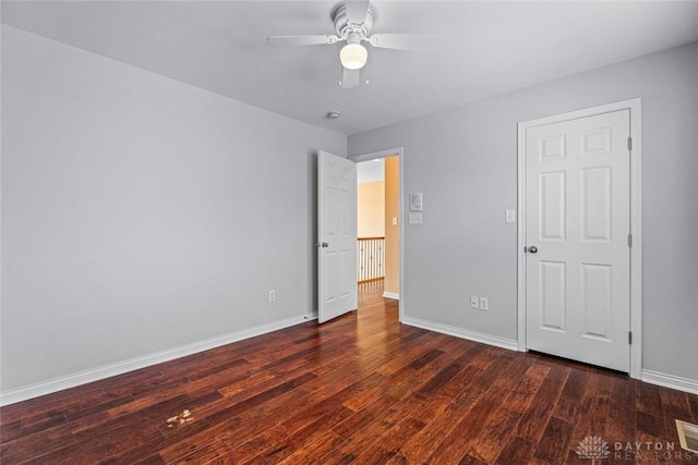 unfurnished bedroom with visible vents, baseboards, and wood-type flooring