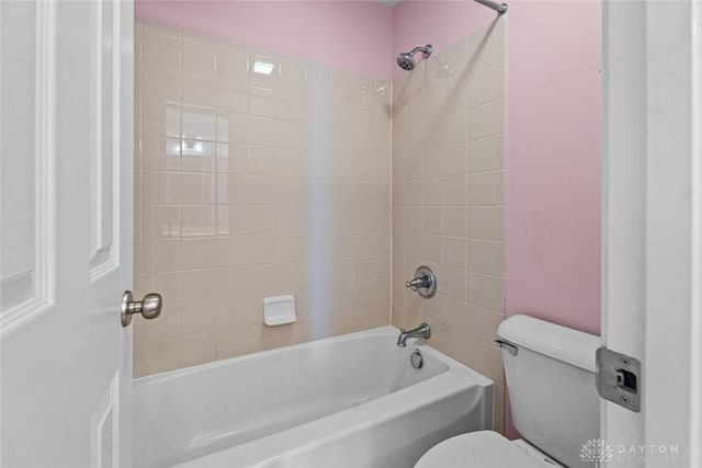 bathroom with shower / bathing tub combination and toilet