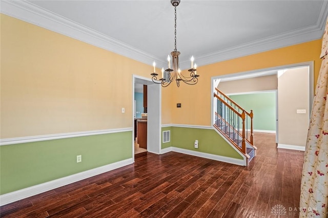 empty room featuring visible vents, a notable chandelier, dark wood-style floors, baseboards, and stairs